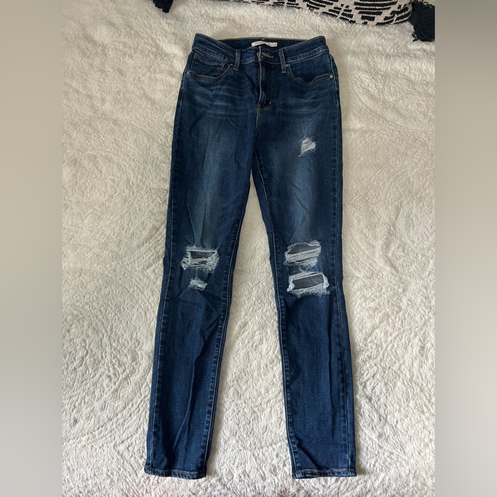 Levi’s jeans with rips. Size 28